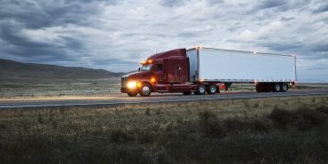 truck on a highway through the grasslands area of eastern Washington, USA.